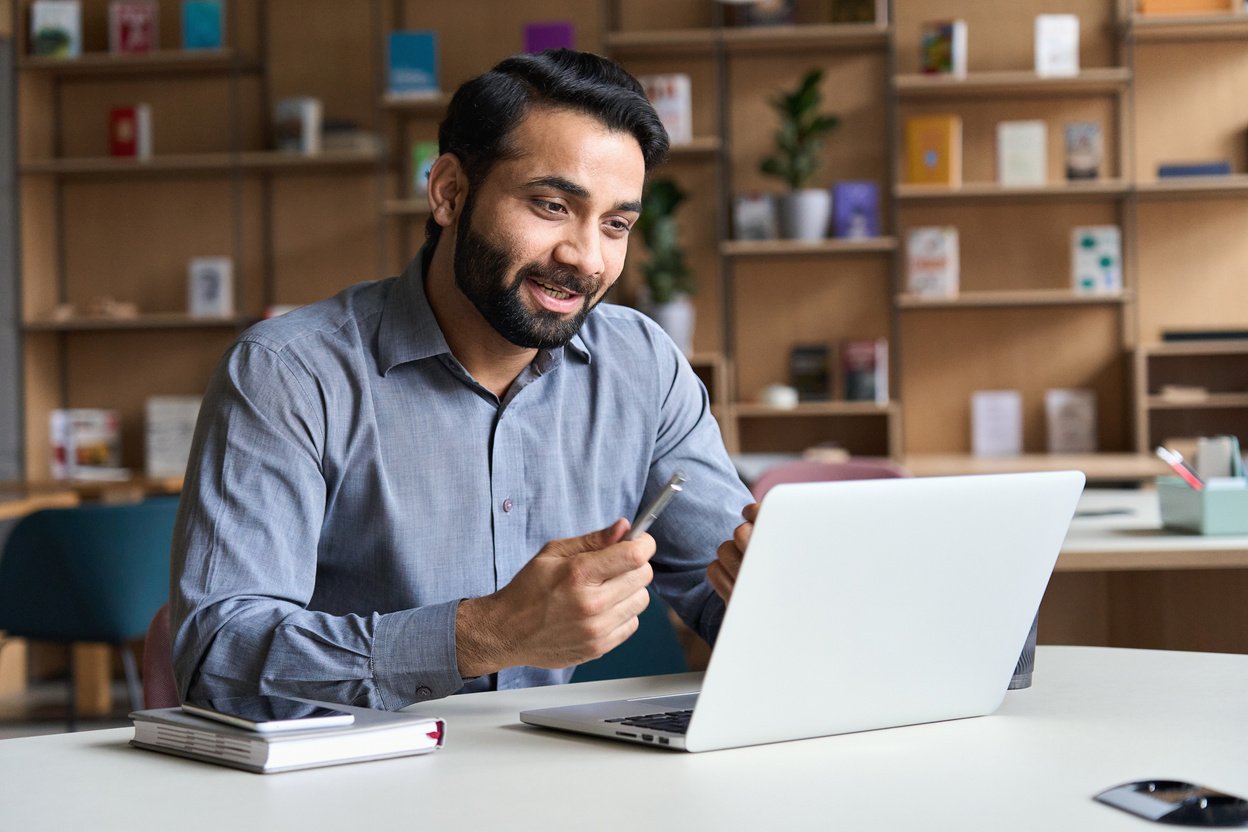 Businessman Having an Online Meeting Using Laptop